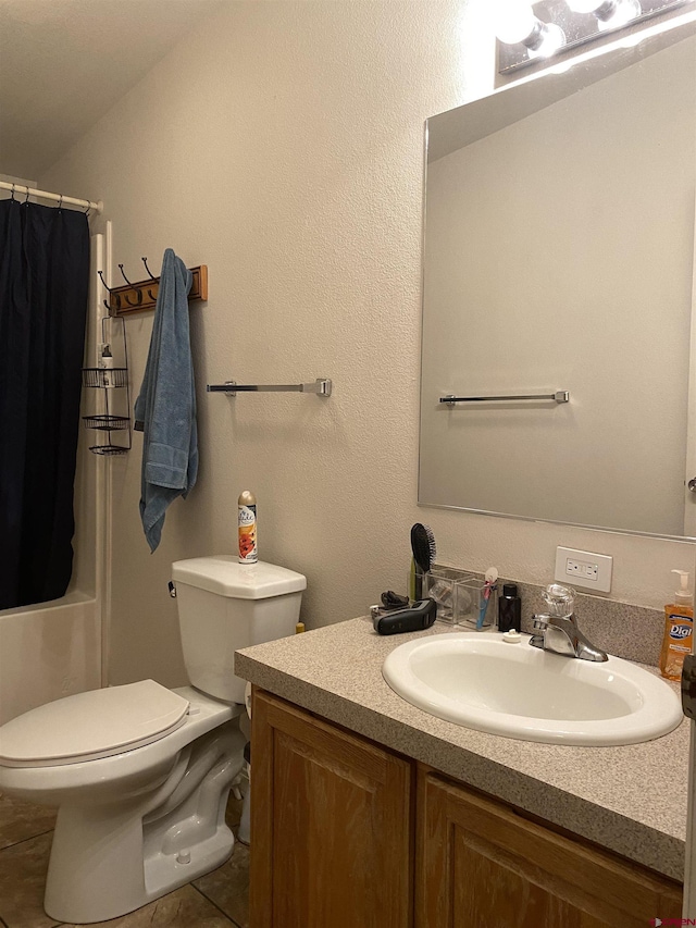 bathroom with vanity, curtained shower, tile patterned floors, and toilet