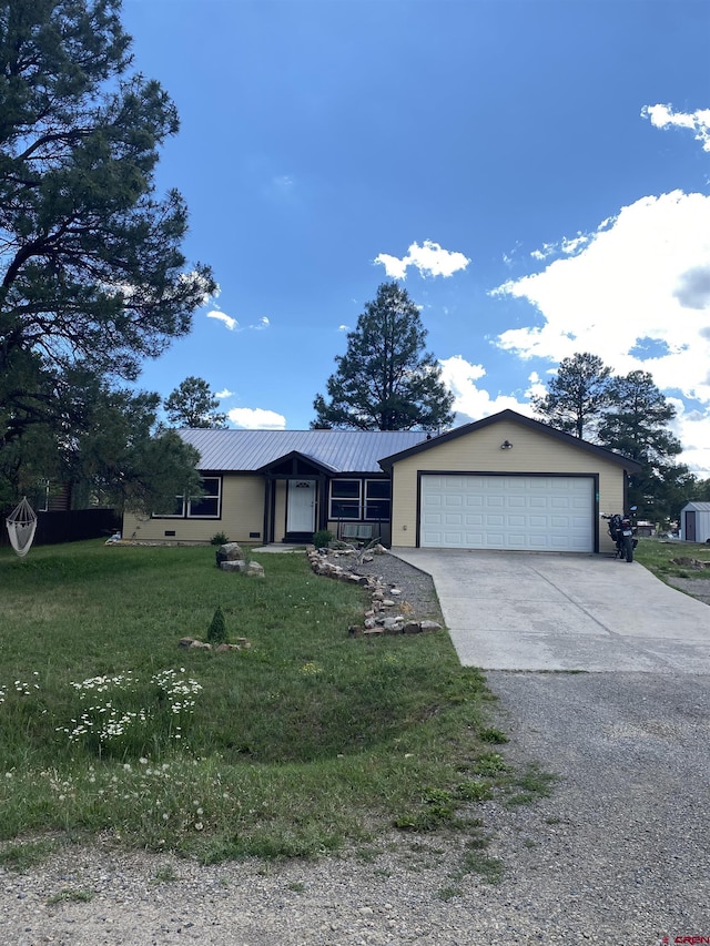 single story home featuring a garage and a front yard