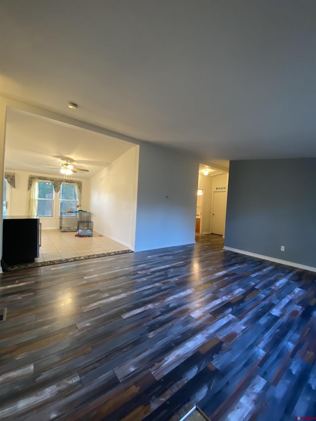 unfurnished room featuring wood-type flooring and ceiling fan