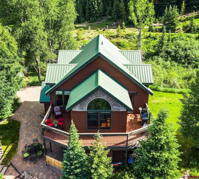 view of side of home featuring a patio area