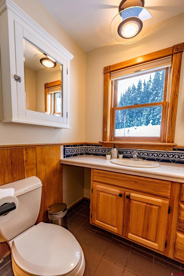 bathroom with tile patterned floors, toilet, and vanity