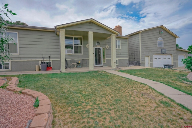 view of front facade with a garage and a front yard