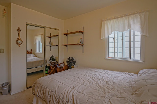 bedroom featuring a closet and carpet flooring