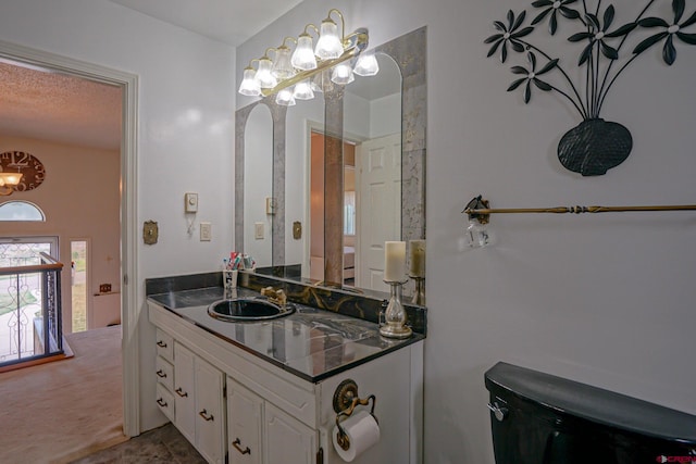 bathroom featuring tile patterned floors, vanity, and toilet