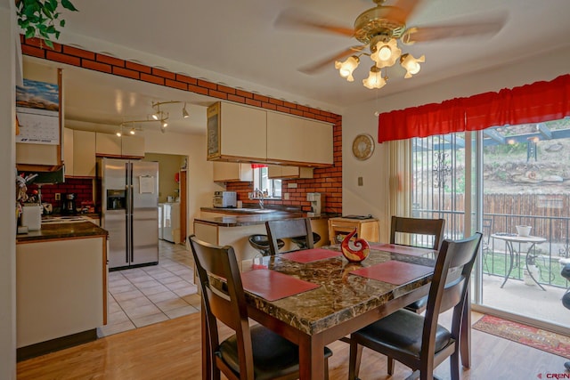 dining room with light tile patterned floors and ceiling fan