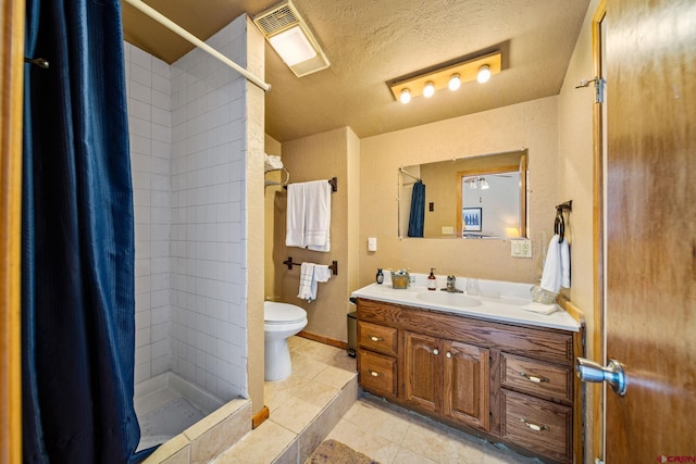 bathroom featuring tile patterned flooring, a textured ceiling, toilet, vanity, and a shower with shower curtain