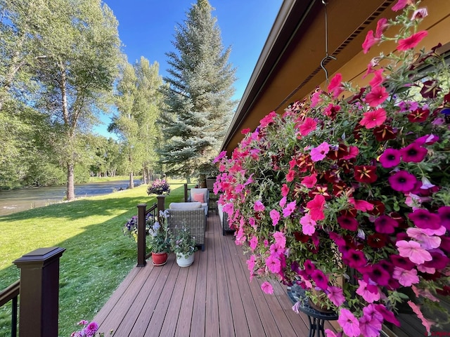 deck featuring a lawn