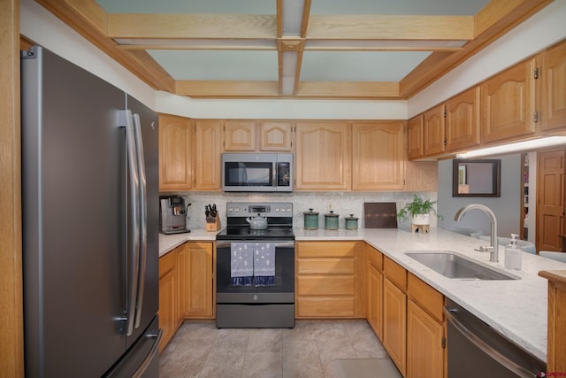 kitchen featuring a sink, decorative backsplash, and stainless steel appliances