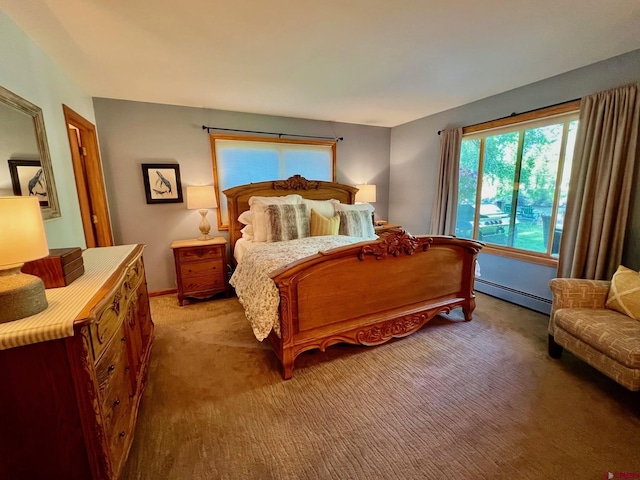 bedroom with light carpet and baseboard heating