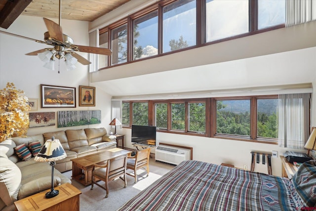 living room featuring carpet floors, wooden ceiling, ceiling fan, and high vaulted ceiling