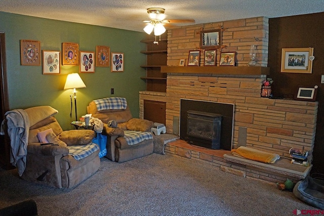 living room featuring a stone fireplace, carpet flooring, and a textured ceiling