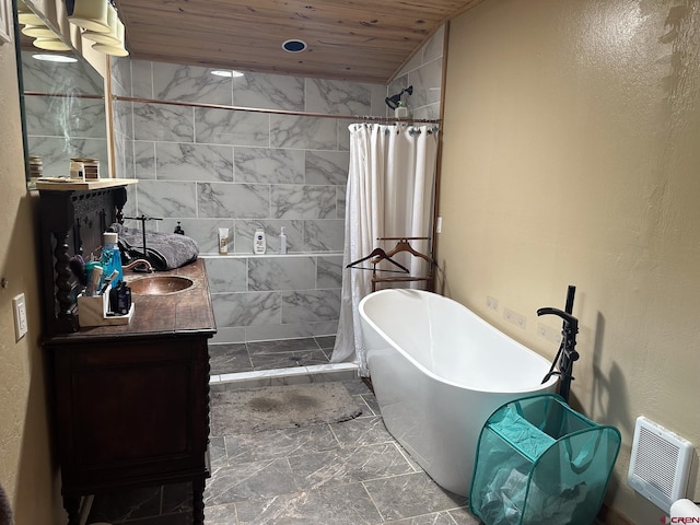 bathroom featuring lofted ceiling, tile patterned floors, a tub, vanity, and wooden ceiling