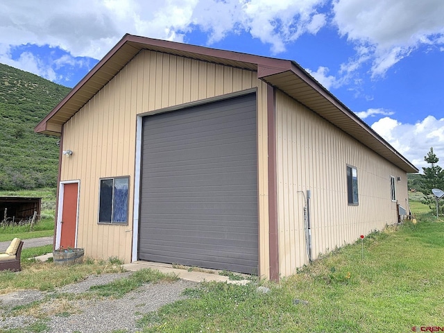 garage with a lawn