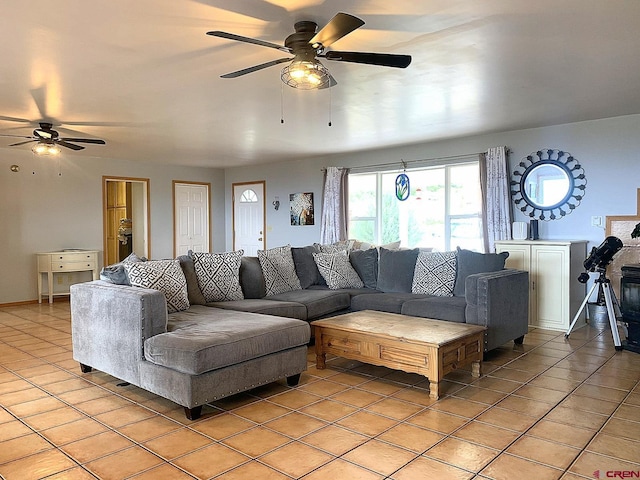 living room with ceiling fan and light tile patterned floors