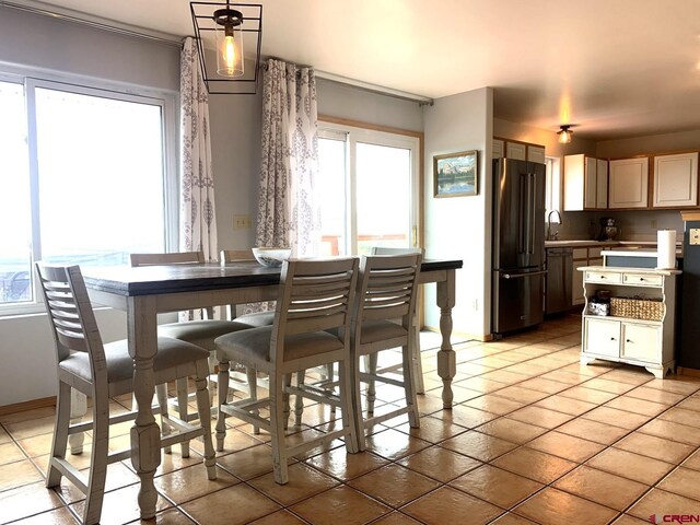 tiled dining space with sink