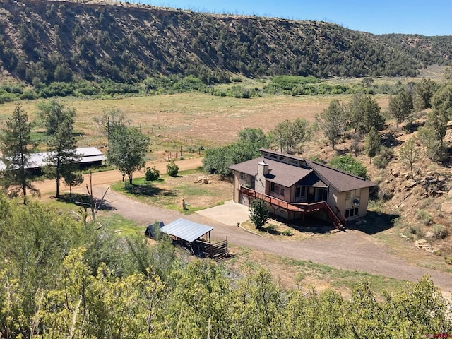 aerial view featuring a rural view and a mountain view