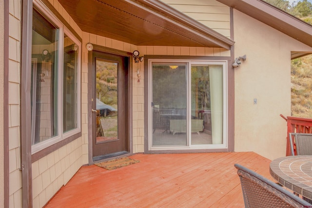 doorway to property with a wooden deck