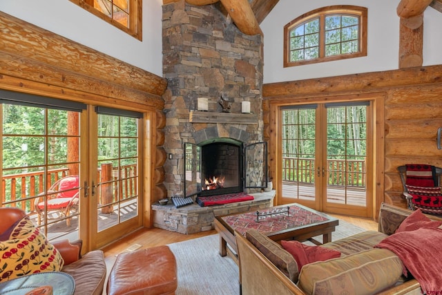 living room featuring wood-type flooring, a wealth of natural light, and french doors