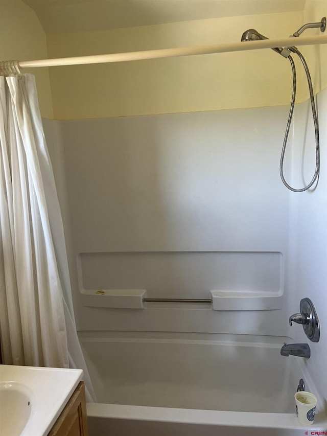 bathroom with vanity and shower / tub combo with curtain