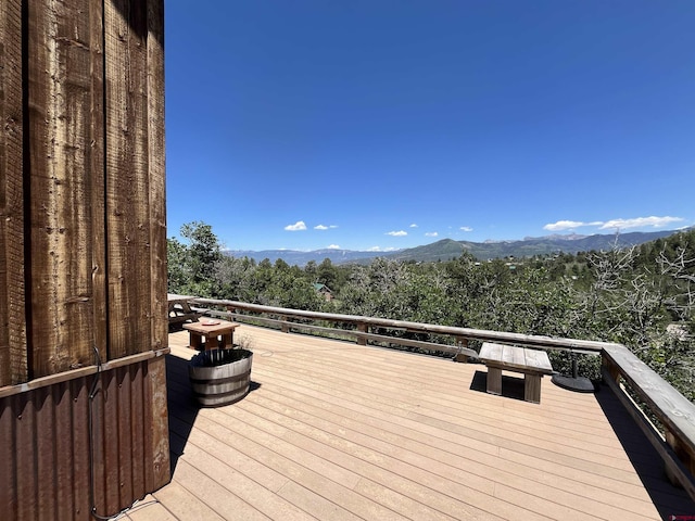 wooden terrace with a mountain view