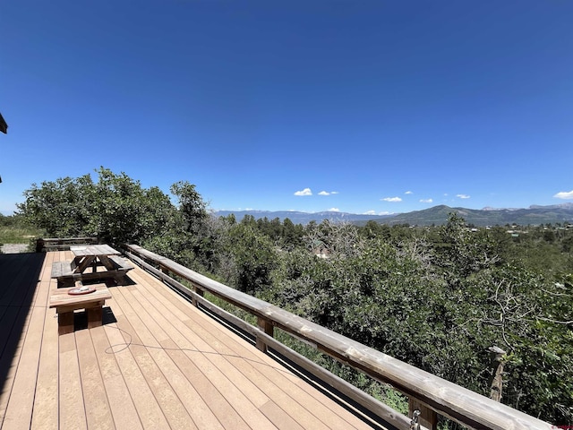 wooden deck featuring a mountain view