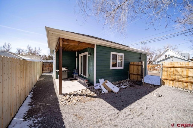 rear view of property featuring a patio