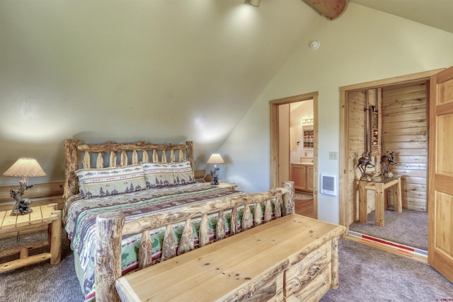 carpeted bedroom with lofted ceiling with beams and ensuite bathroom