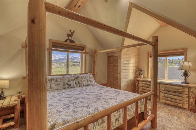 bedroom featuring beamed ceiling, high vaulted ceiling, and carpet