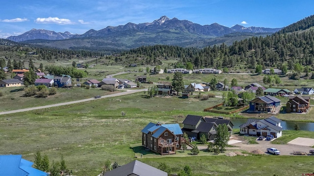 birds eye view of property with a mountain view