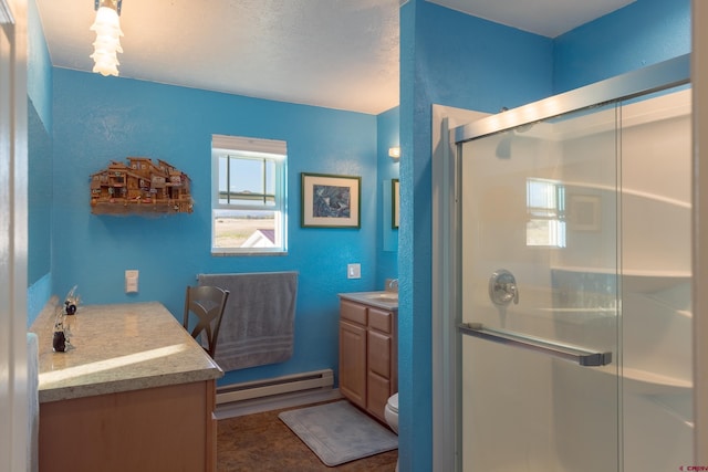 bathroom featuring toilet, a shower stall, baseboard heating, and vanity