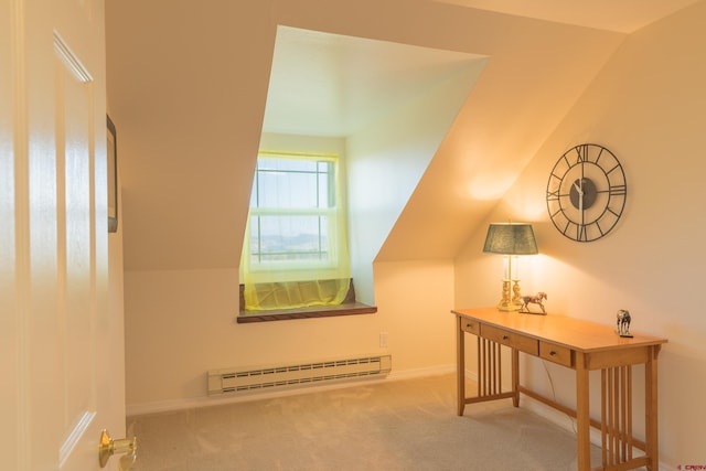 bonus room with a baseboard heating unit, carpet floors, lofted ceiling, and baseboards