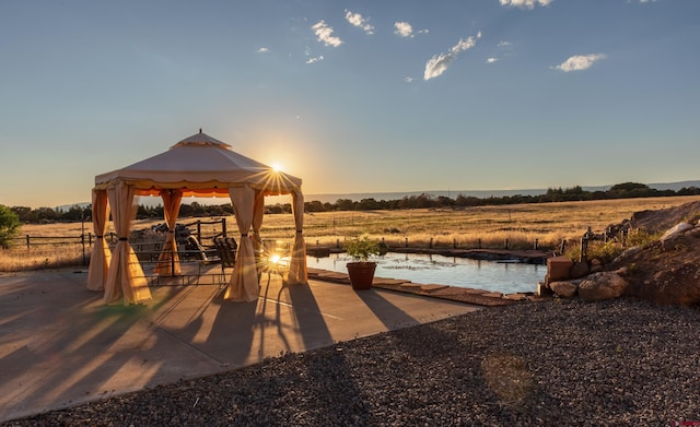 exterior space featuring a rural view and a gazebo