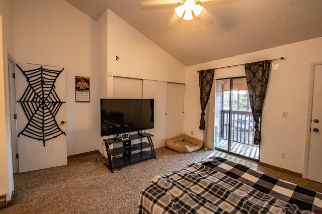 interior space with ceiling fan, access to exterior, a textured ceiling, vaulted ceiling, and a closet