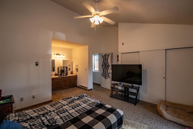 carpeted bedroom featuring lofted ceiling, a textured ceiling, ceiling fan, and a closet