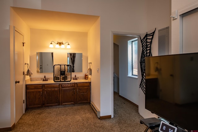 bathroom featuring vanity and baseboard heating