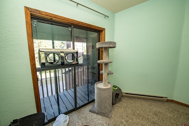 interior details with a baseboard radiator and carpet floors