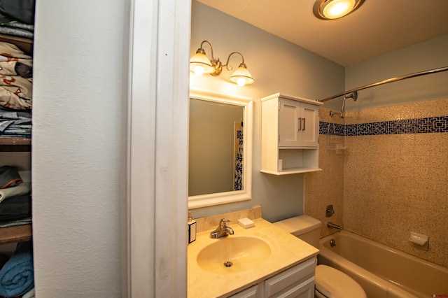 full bathroom with vanity, toilet, and tiled shower / bath