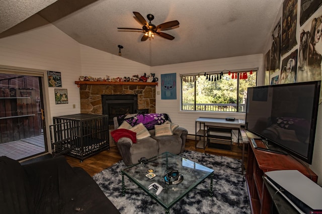 living room with hardwood / wood-style flooring, vaulted ceiling, and a textured ceiling