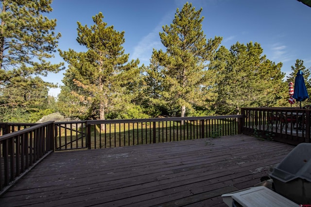 wooden terrace featuring area for grilling