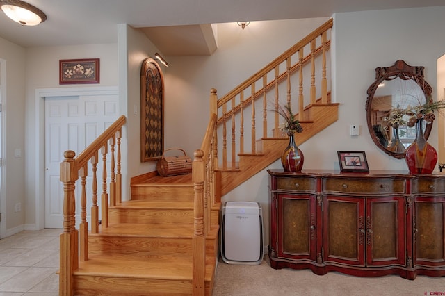 stairway with tile patterned flooring