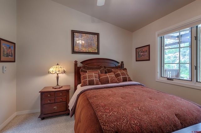 bedroom featuring light colored carpet, ceiling fan, and lofted ceiling