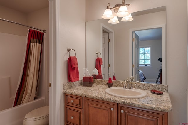 full bathroom featuring vanity, toilet, and shower / bathtub combination with curtain