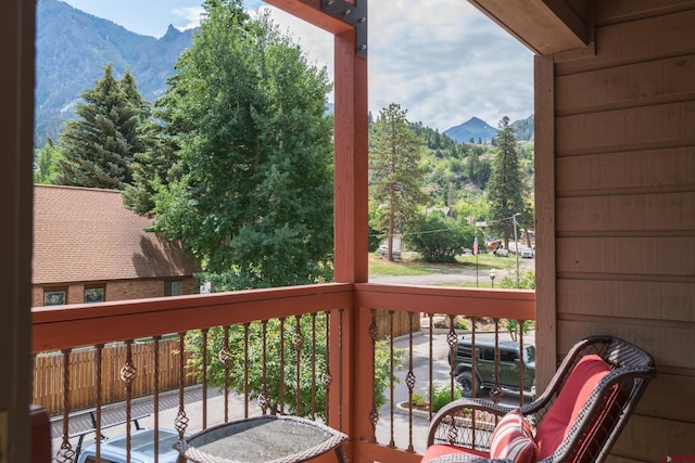 wooden deck featuring a mountain view