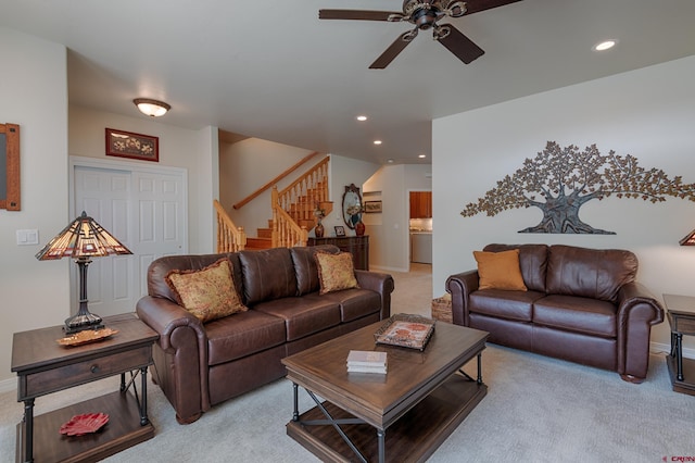 carpeted living room featuring ceiling fan