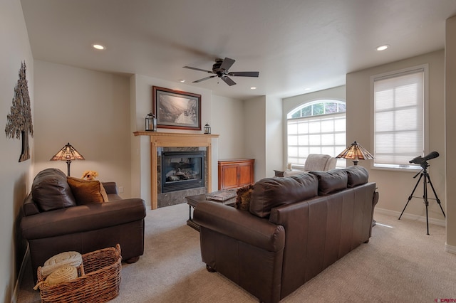 living room with ceiling fan and light colored carpet