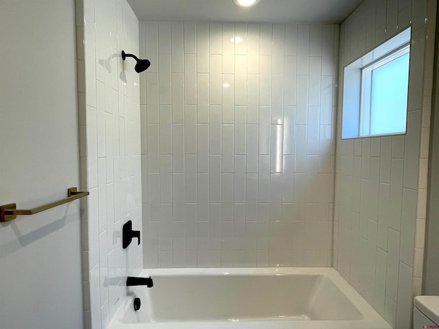 bathroom with toilet and shower / washtub combination