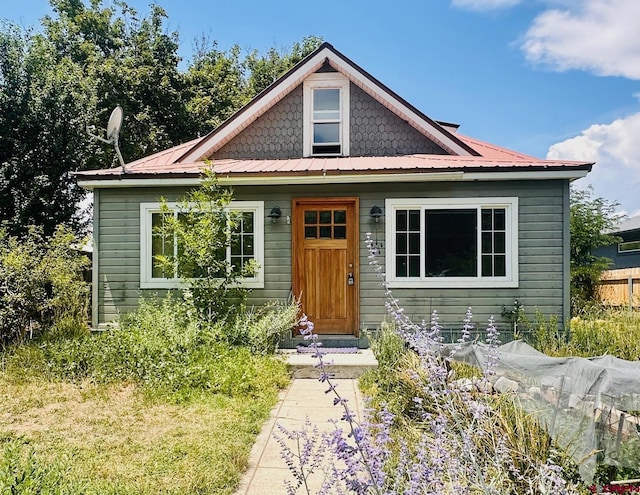 bungalow-style house with metal roof