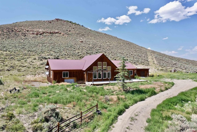 rear view of property with a mountain view