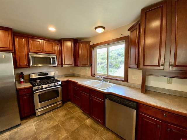 kitchen with appliances with stainless steel finishes and sink