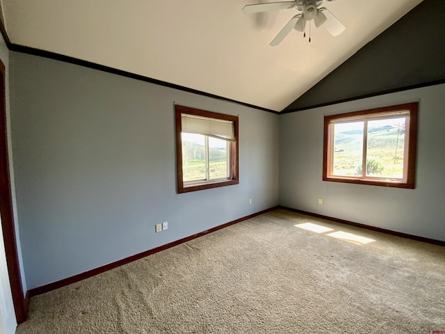 spare room with carpet flooring, plenty of natural light, and ceiling fan